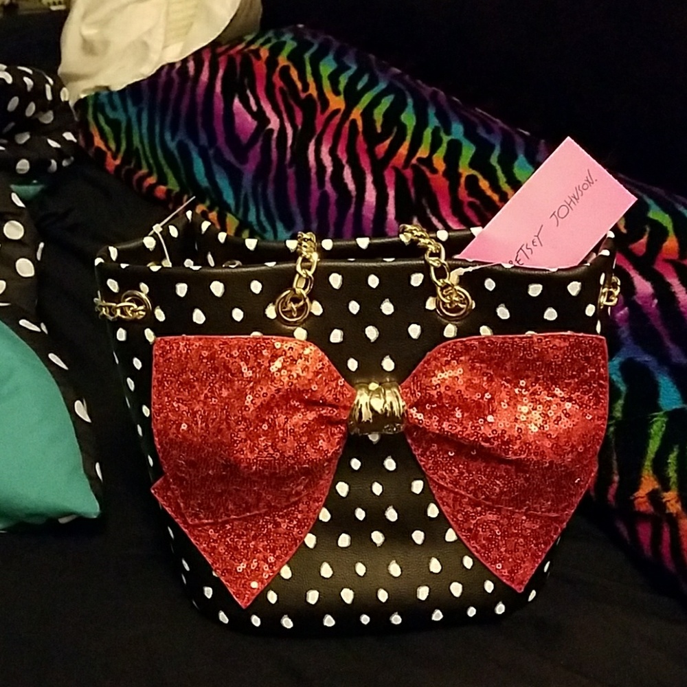 Betsey johnson purse with red bow. Tags still on